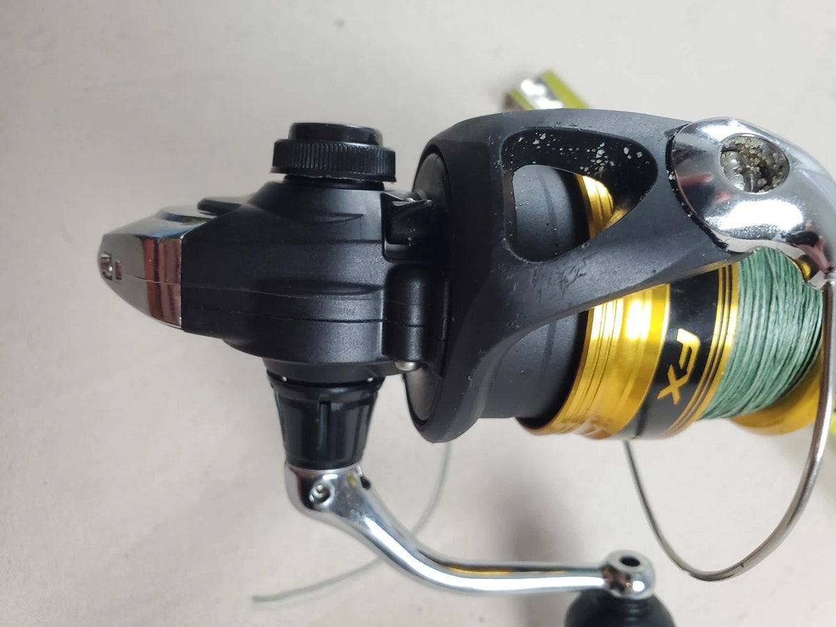 SHIMANO 2500HG Reel spun with heavy braided line. Appears unused.