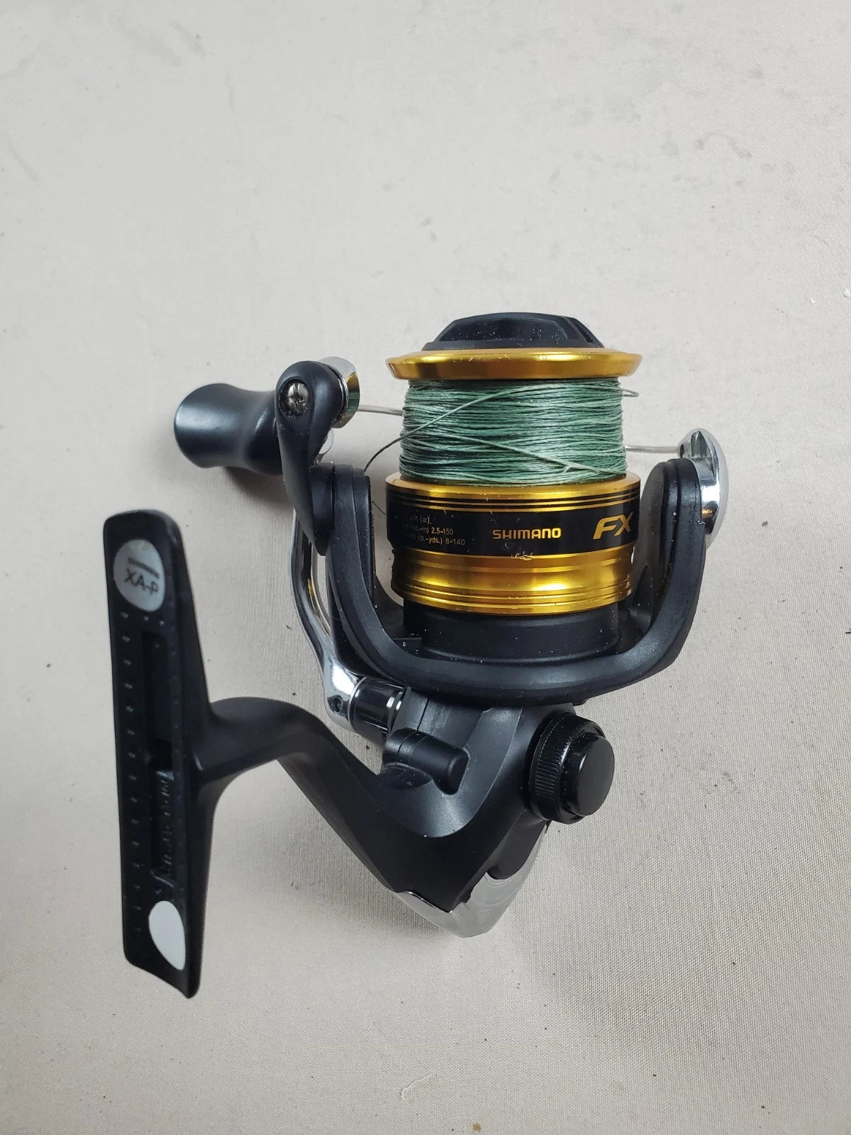 SHIMANO 2500HG Reel spun with heavy braided line. Appears unused.