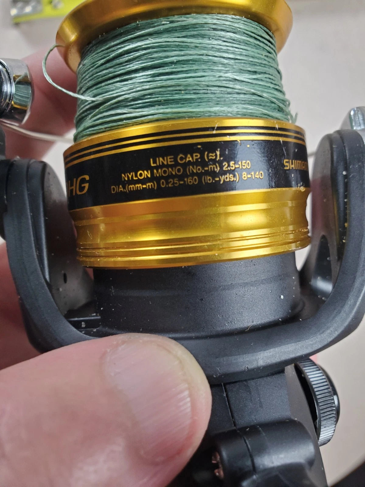 SHIMANO 2500HG Reel spun with heavy braided line. Appears unused.