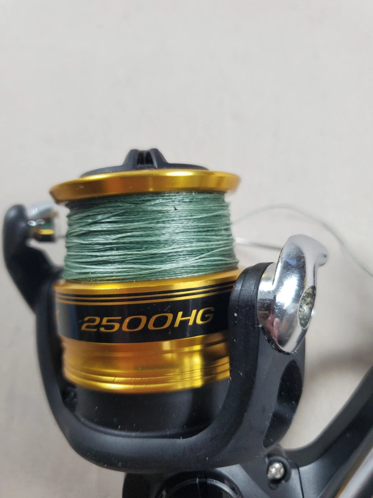 SHIMANO 2500HG Reel spun with heavy braided line. Appears unused.
