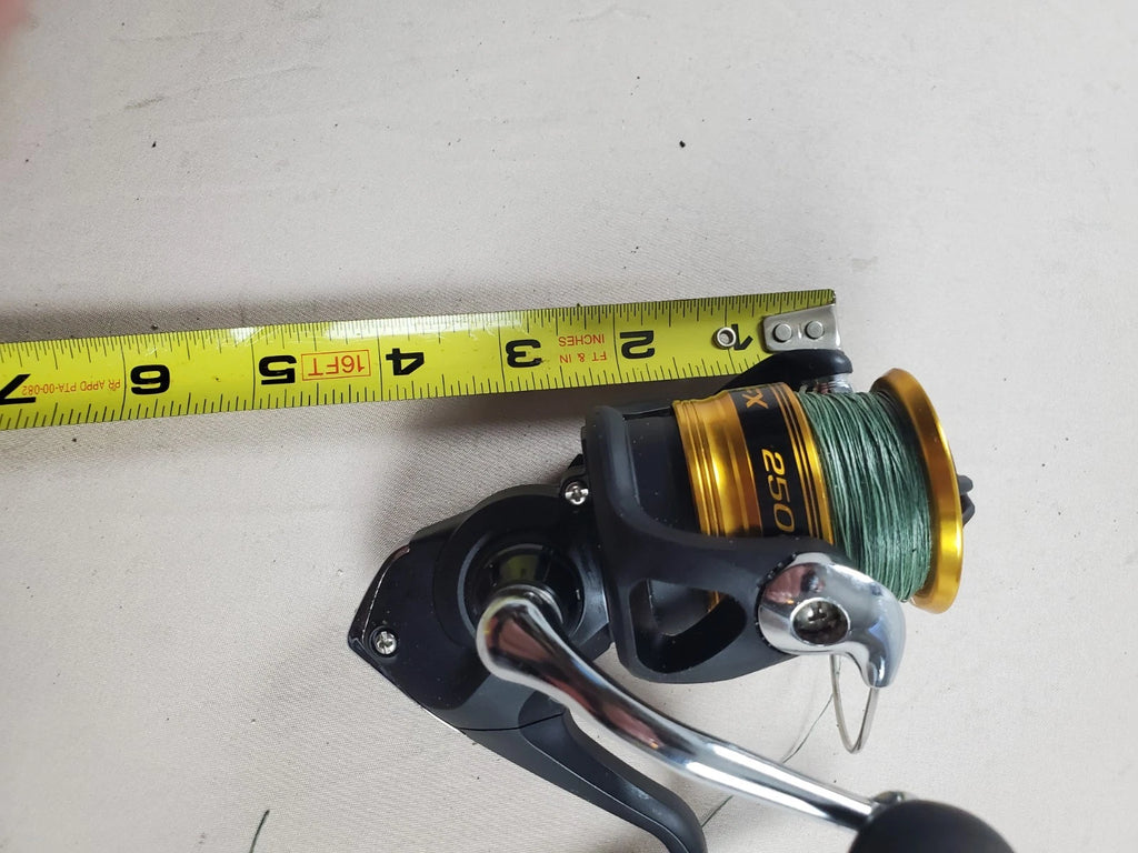 SHIMANO 2500HG Reel spun with heavy braided line. Appears unused.