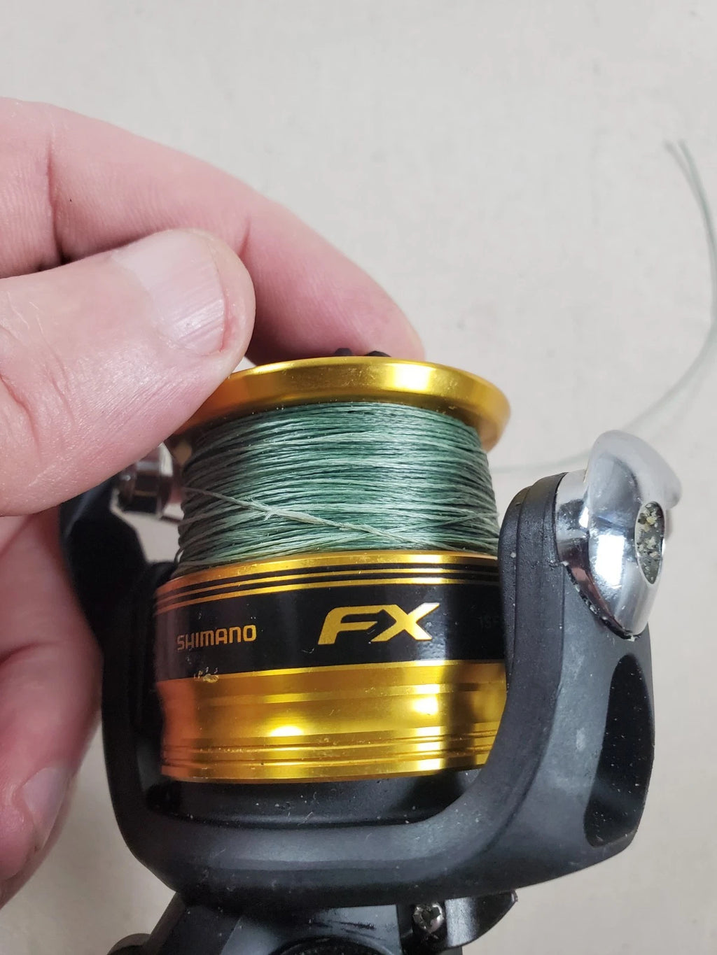 SHIMANO 2500HG Reel spun with heavy braided line. Appears unused.