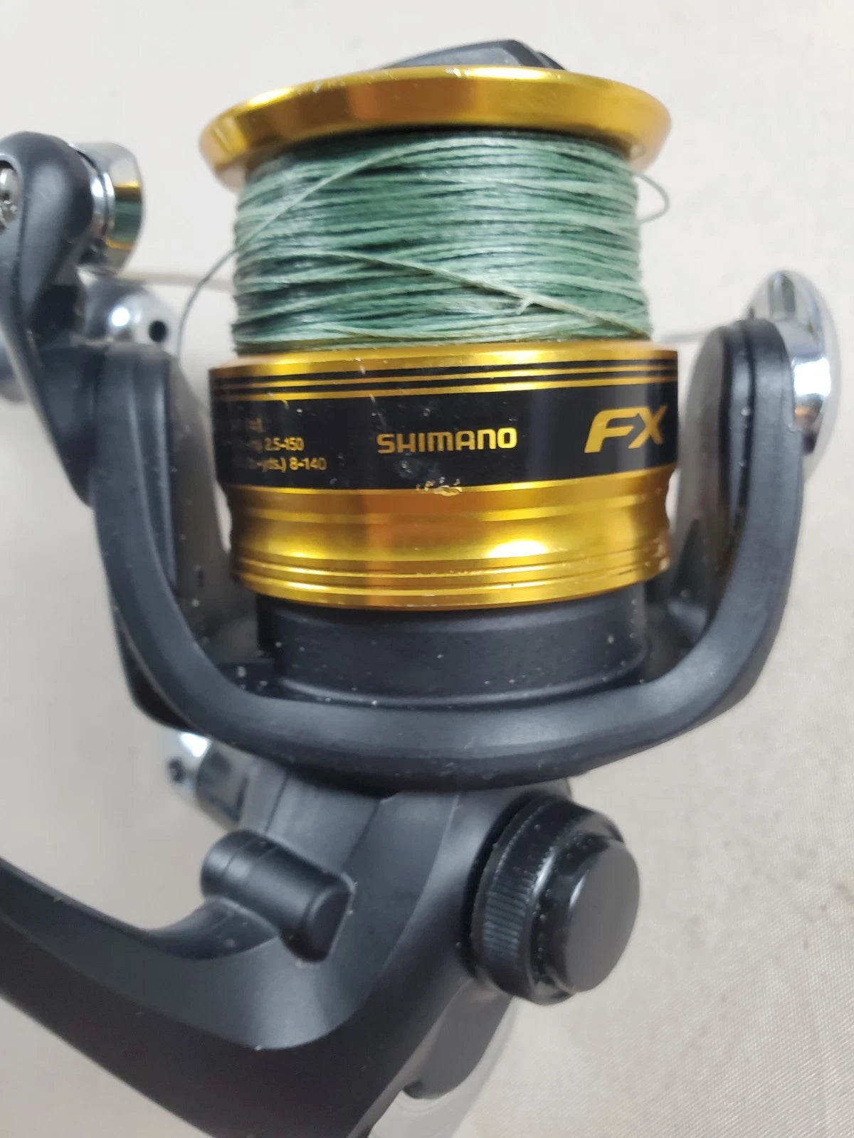 SHIMANO 2500HG Reel spun with heavy braided line. Appears unused.