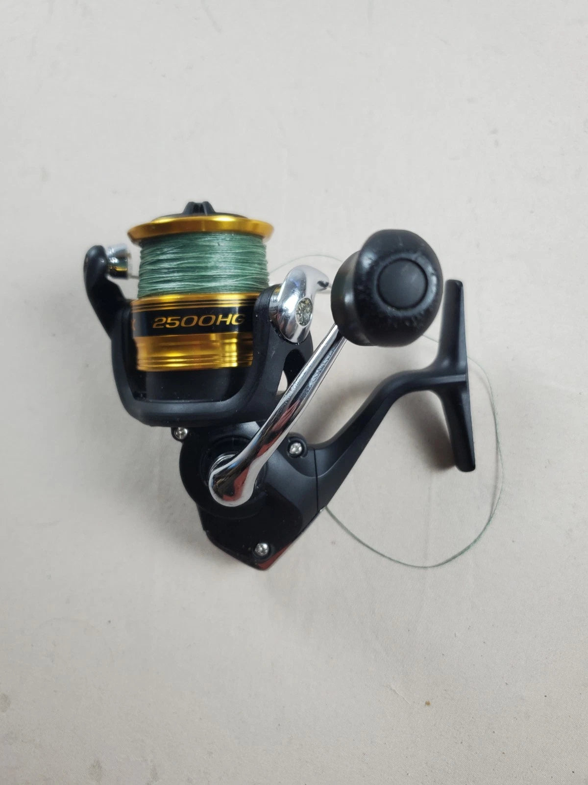 SHIMANO 2500HG Reel spun with heavy braided line. Appears unused.
