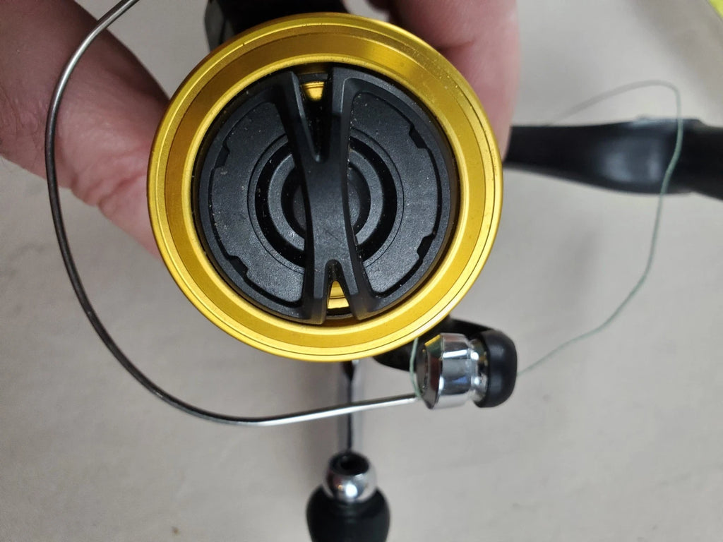 SHIMANO 2500HG Reel spun with heavy braided line. Appears unused.